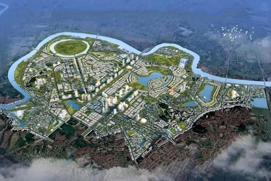 Vinhomes Hòa Long Bắc Ninh 16 Phối cảnh tổng thể khu đô thị Vinhomes Hòa Long - Bắc Ninh từ trên cao, với các khu nhà ở, cao ốc, hồ nước, công viên xanh, và hệ thống giao thông được quy hoạch bài bản, bao quanh bởi sông và không gian tự nhiên.