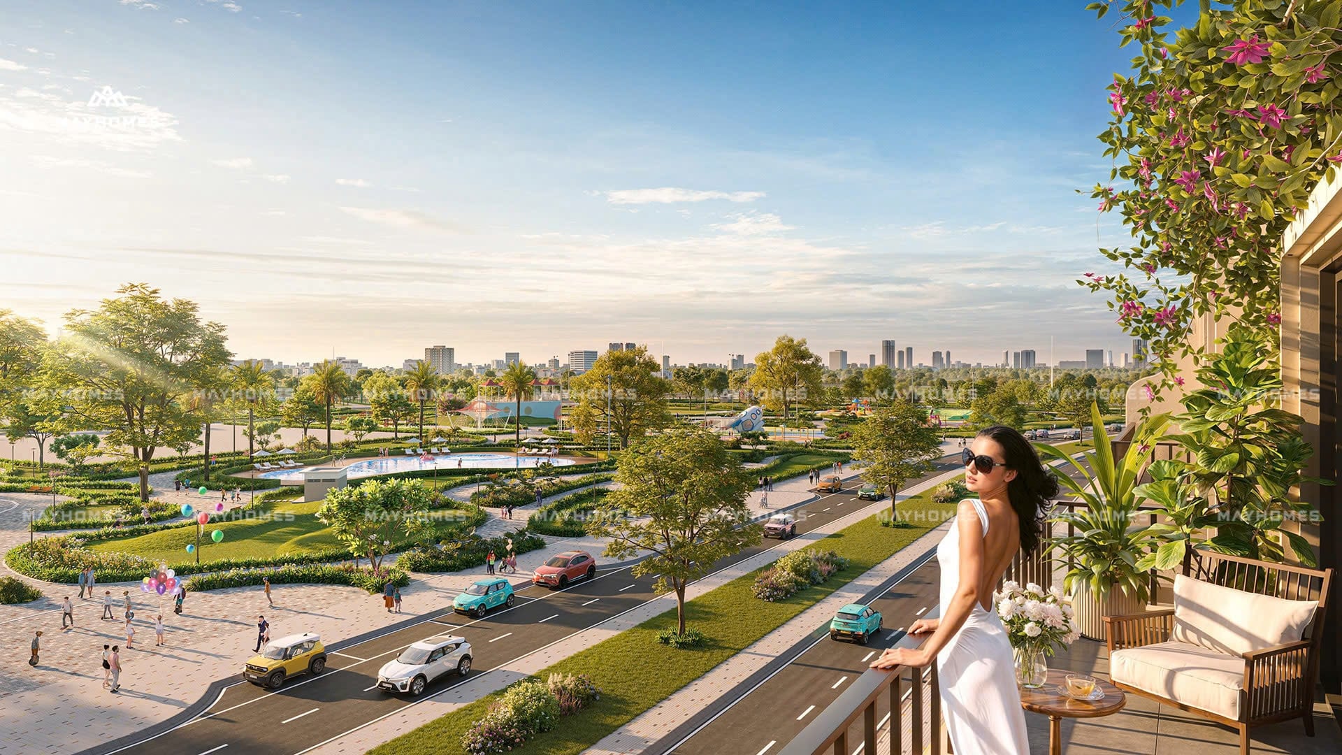 Vinhomes Hòa Long Bắc Ninh 3 ban công căn hộ Vinhomes Hòa Long – Bắc Ninh, phóng tầm mắt ra toàn cảnh công viên xanh mát, đường phố quy hoạch hiện đại, và đường chân trời đô thị Bắc Ninh vào buổi hoàng hôn.