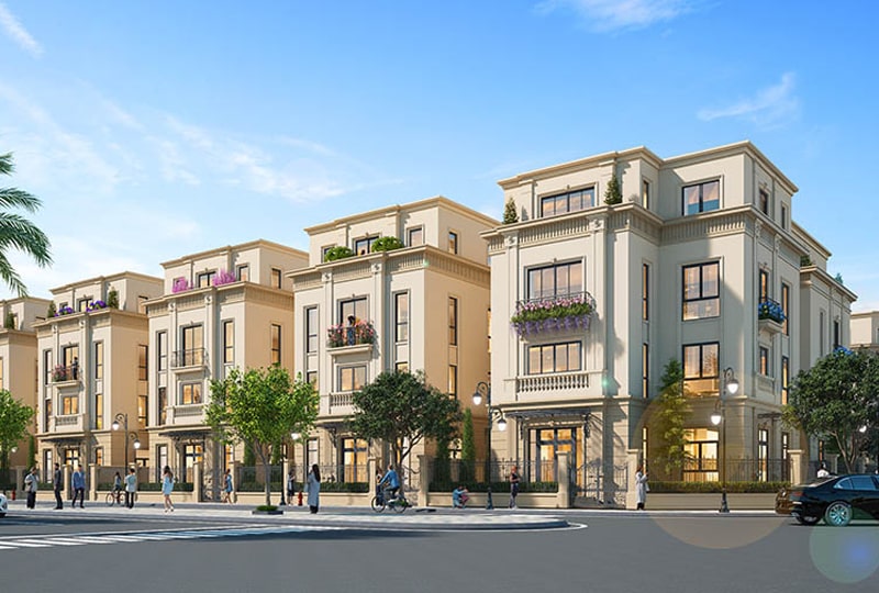 Biệt thự Vinhomes Hòa Long Bắc Ninh – Không gian sống đẳng cấp 3 Dãy biệt thự liền kề cao 3-4 tầng tại dự án Vinhomes Hòa Long – Bắc Ninh, với kiến trúc tân cổ điển, ban công hoa rực rỡ, cây xanh, và lối đi bộ sạch đẹp trong khu đô thị.